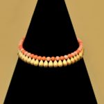 Collier metallo dorato e pietre corallo Trifari, anni 50